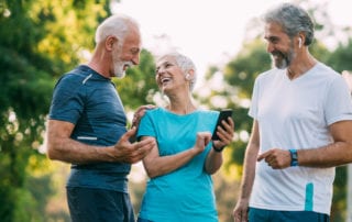 three seniors exercising with app