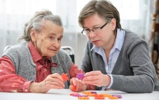 women doing puzzle